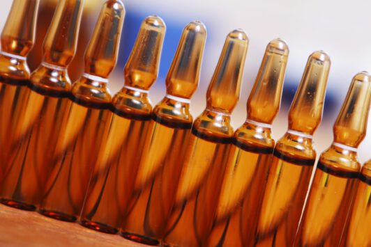 Row of brown vials filled